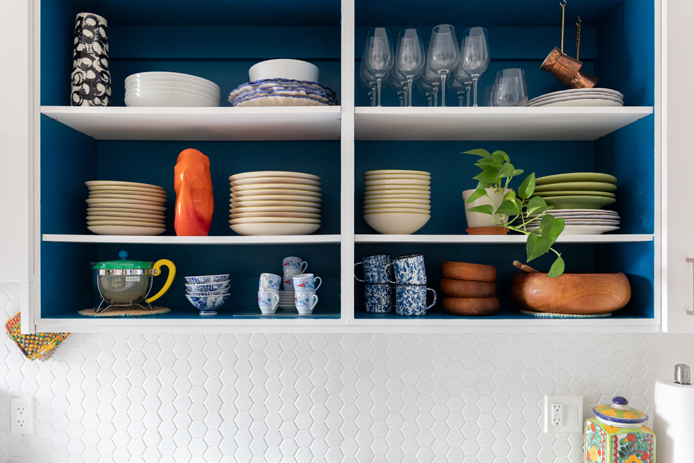 Blue Mood Plates and dishes in blue open shelving in kitchen