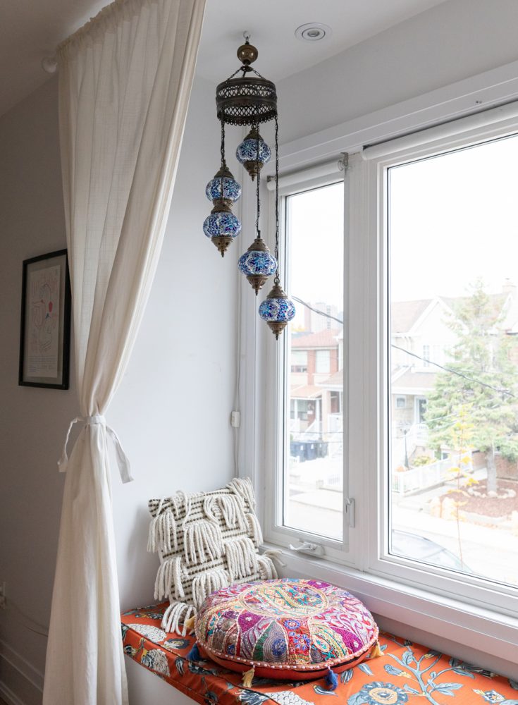 Layers of Pattern and Texture Patterned window seat with two pillows