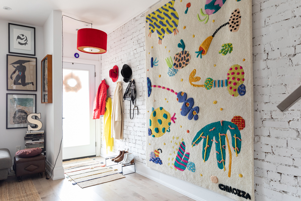 Warm and Welcoming Bright entryway with hanging wall tapestry