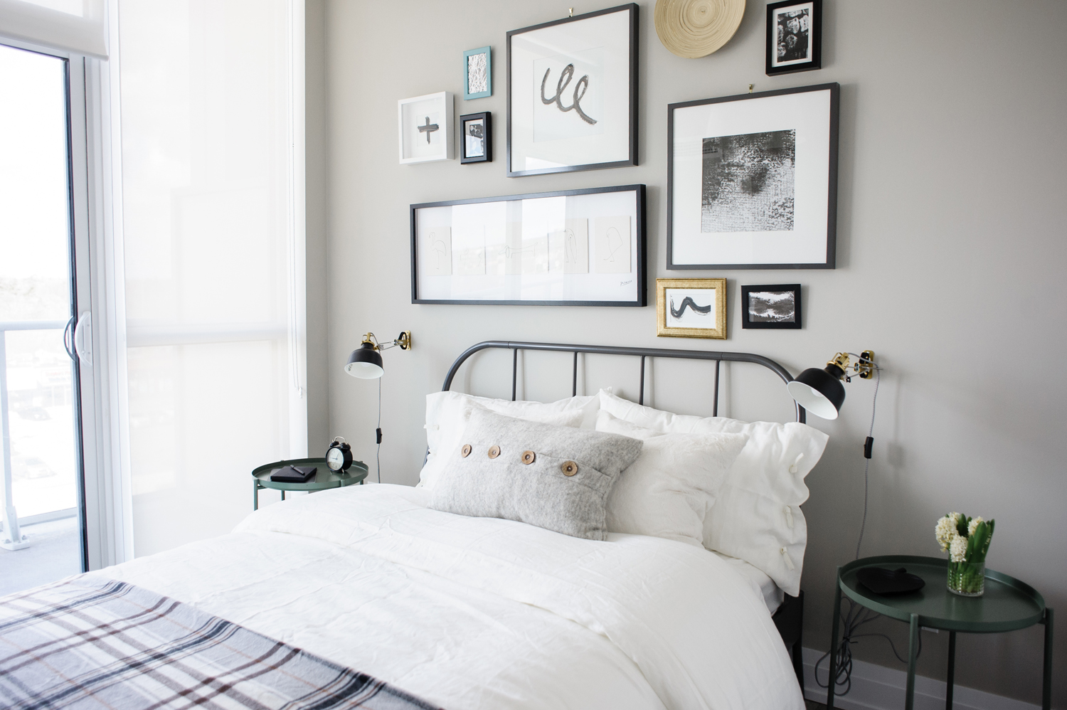 Planning for the Future Guest bedroom with black and white gallery wall