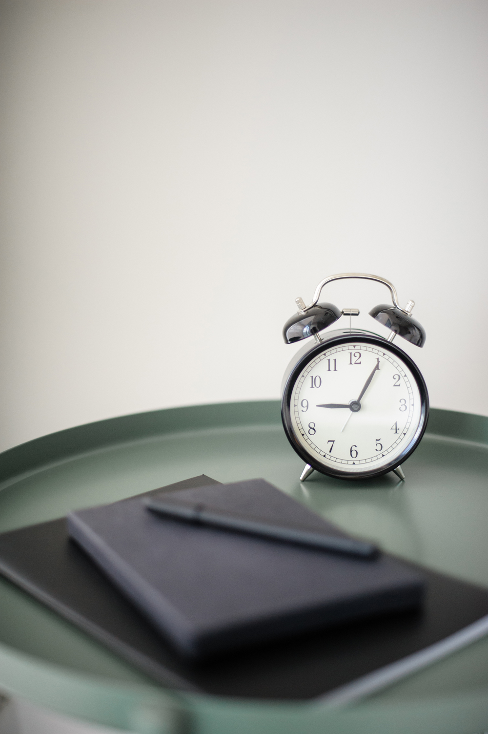 Wakeup Call Bedside table with notebook and alarm clock