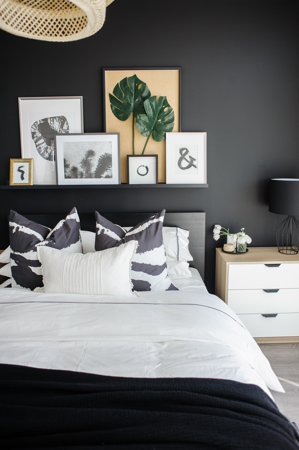 The Casual Gallery Wall Floating shelf over a bed with artwork