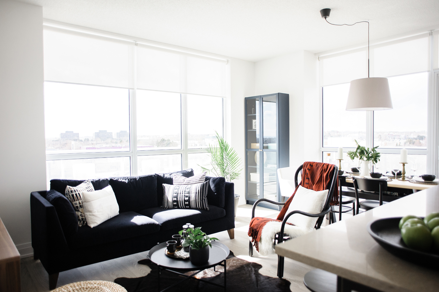 The Job Contemporary black and white living room with a red throw