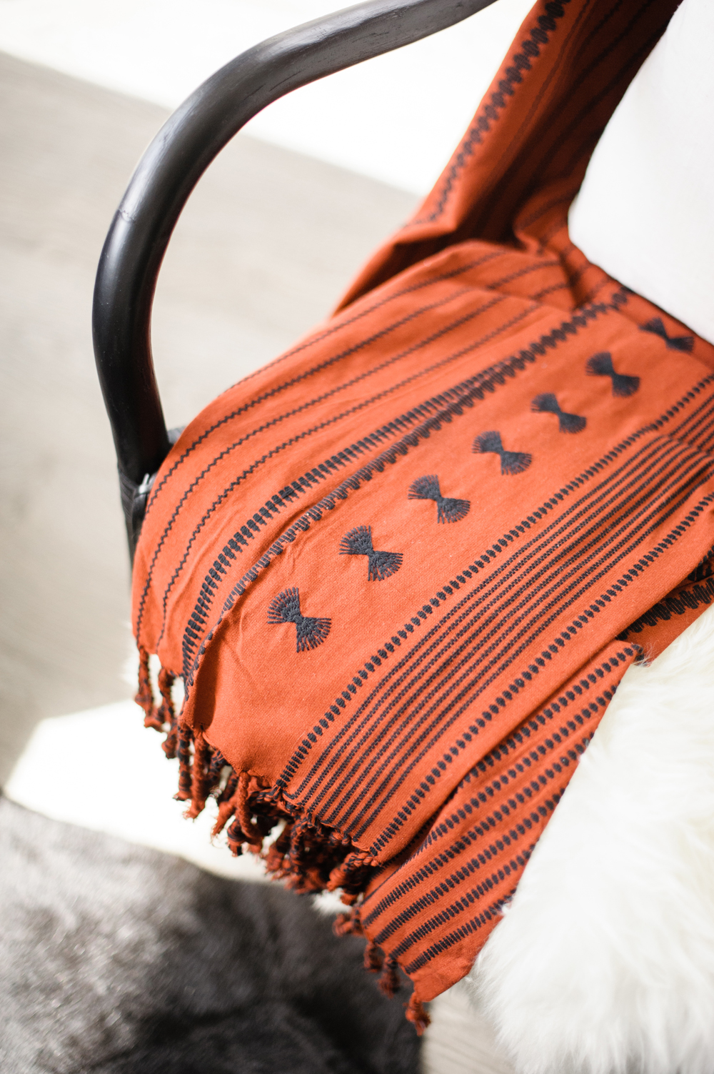 Unique Prints and Patterns Red throw tossed over chair