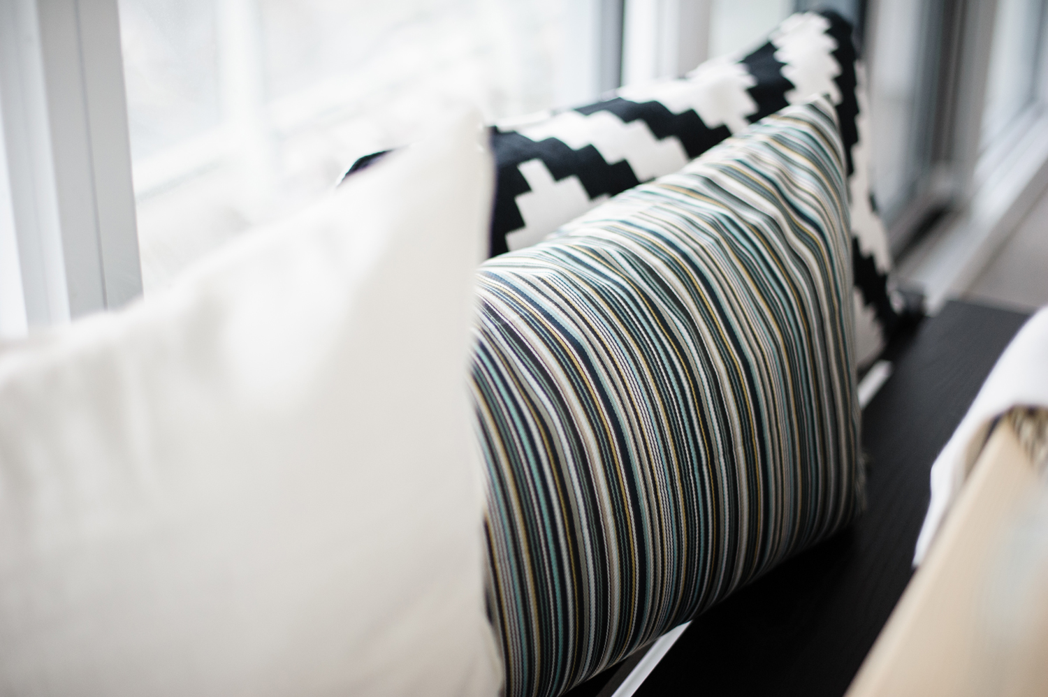A Play on Patters Layered pillows on a bench