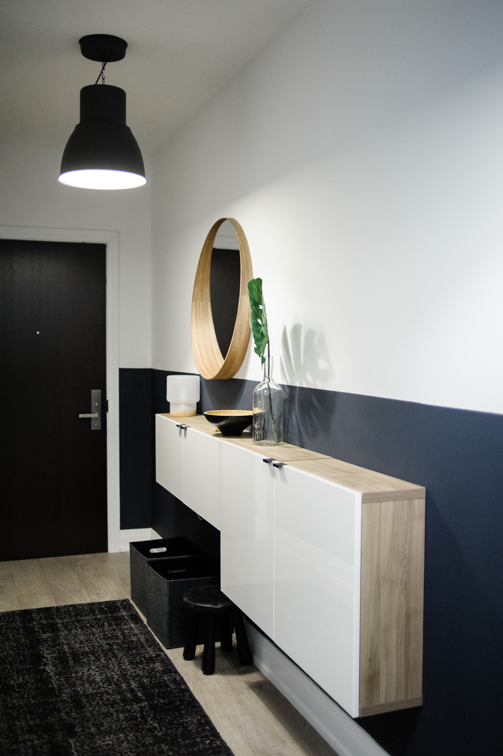 Welcome Home A condo entryway with a half black and half white wall