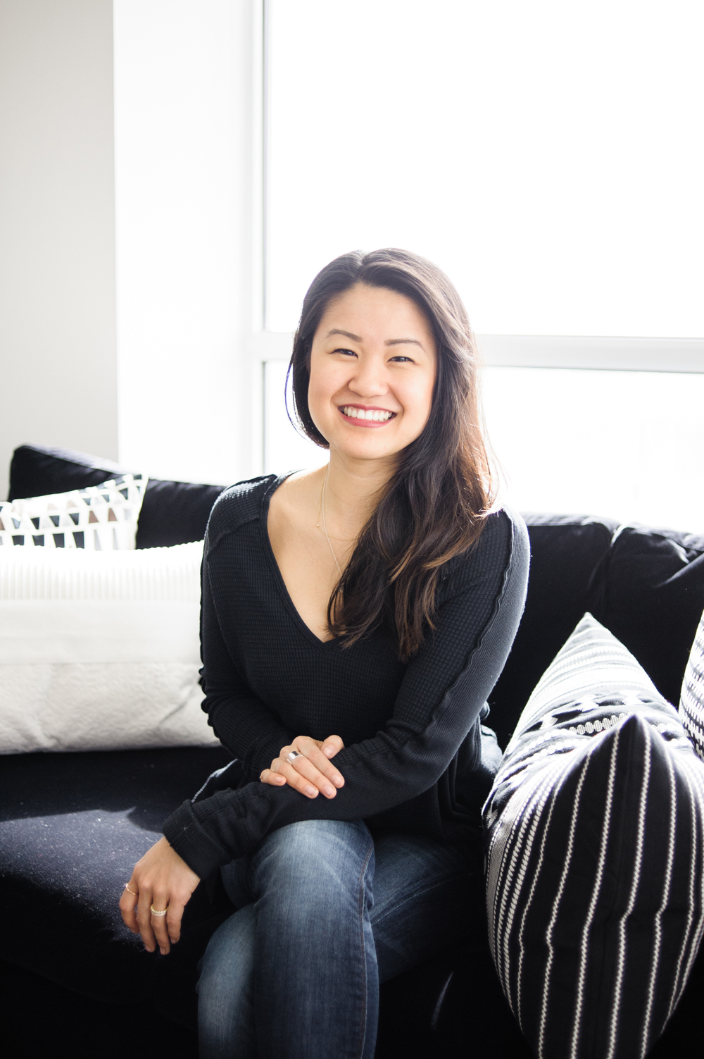 Meet Natalie Interior designer Natalie Chong seated on a sofa