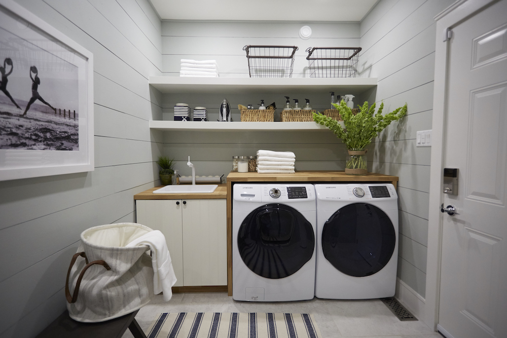 Nautical Notions Nautical laundry room design with ample storage space.
