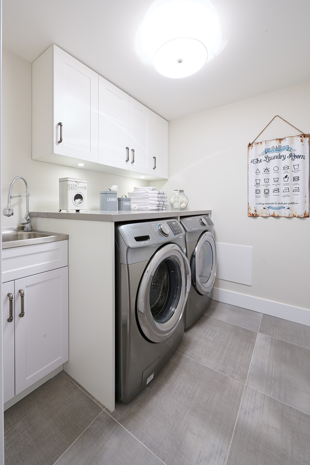 Pure and Simple All-white laundry room design.