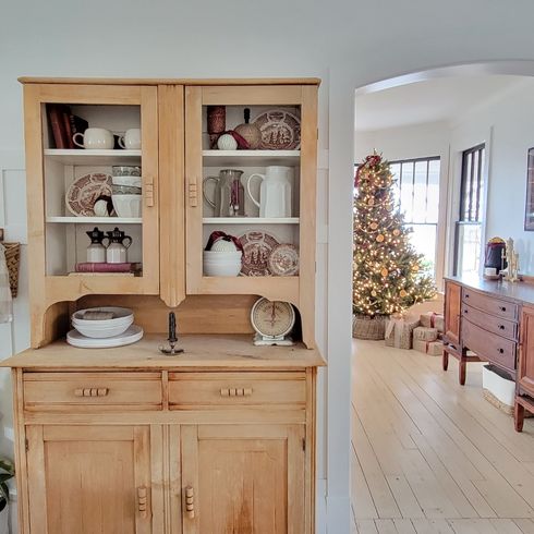 Holiday Hutch Hutch with a Christmas tree in background