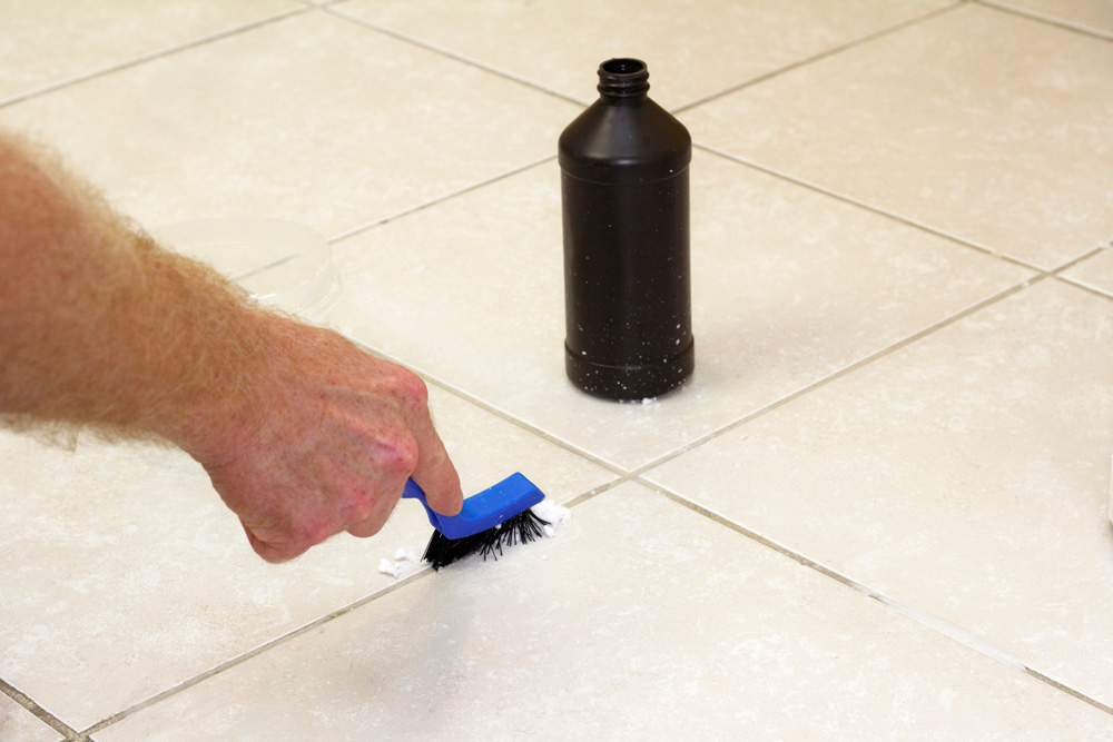 Hydrogen Peroxide and Vinegar person cleaning with hydrogen peroxide