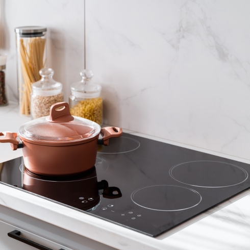 7. Induction Is In-Demand An induction cooktop being used in a modern kitchen to cook food, a home appliance trend for 2025