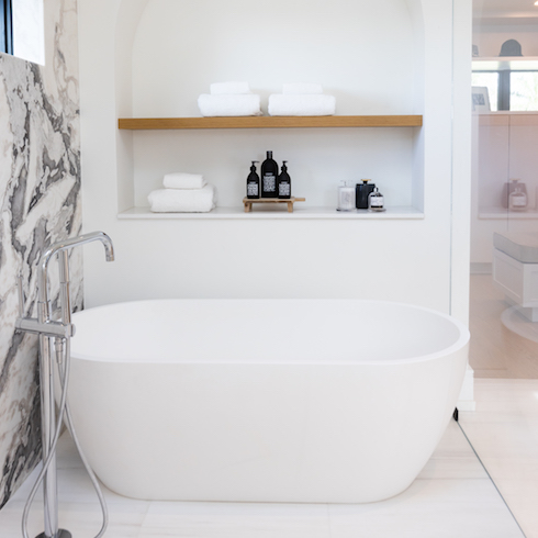 A New Ensuite Large soaker tub and built in bathroom storage