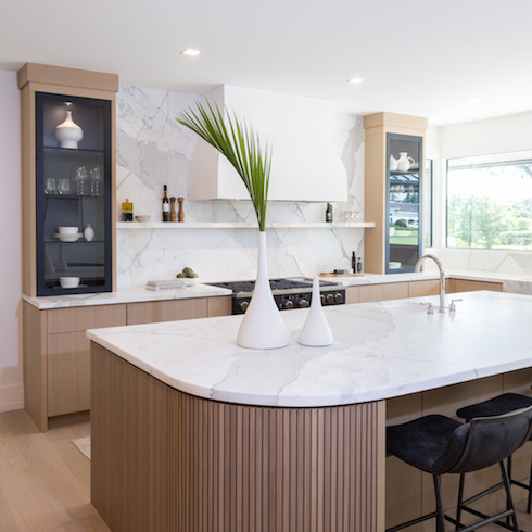 An Updated New Kitchen Wood and white kitchen with giant island