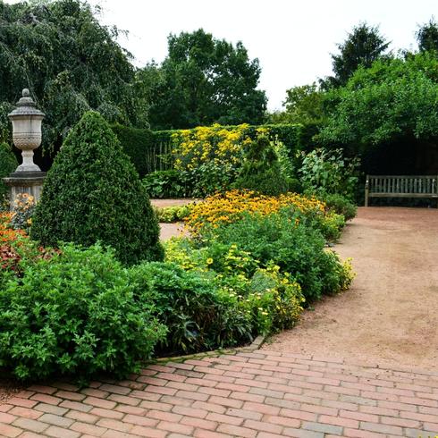Elaborate Landscaping A front yard with landscaping and trees