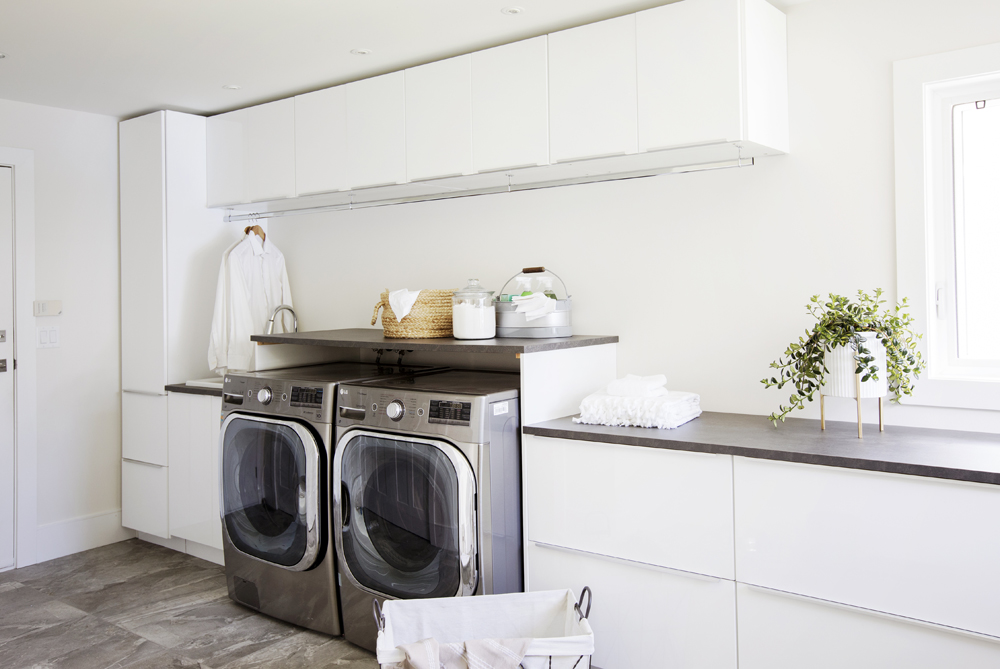 Fresh Air Bright white modern laundry room design.