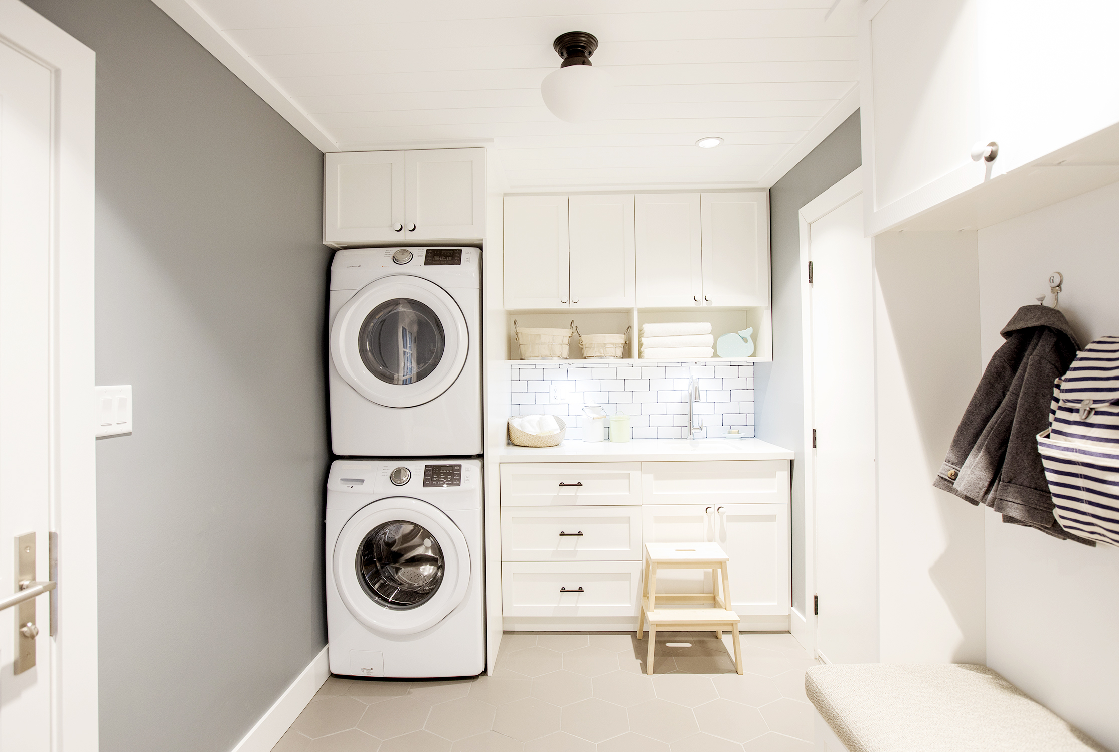 Pearly White Modern white laundry room design by Jillian Harris.