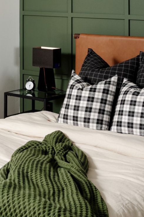 Pile on the Plaid Two plaid pillows on a bed