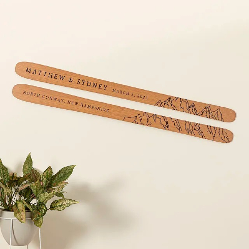 More Than a Hobby A pair of personalized engraved wooden skis hung to the wall