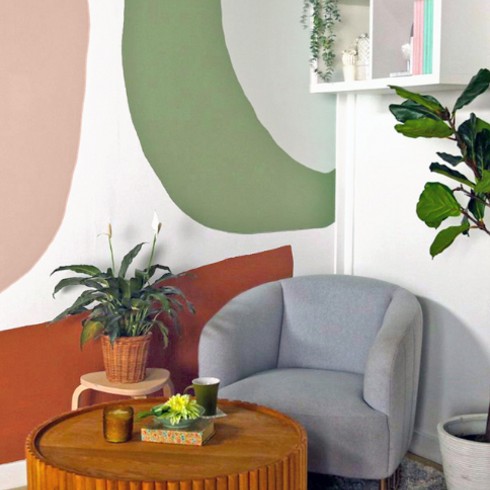 Paint it Pretty A DIY accent wall with pink and sage green swoops