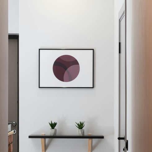 Embrace Minimalism The end of a hallway showing open space with minimal decor.