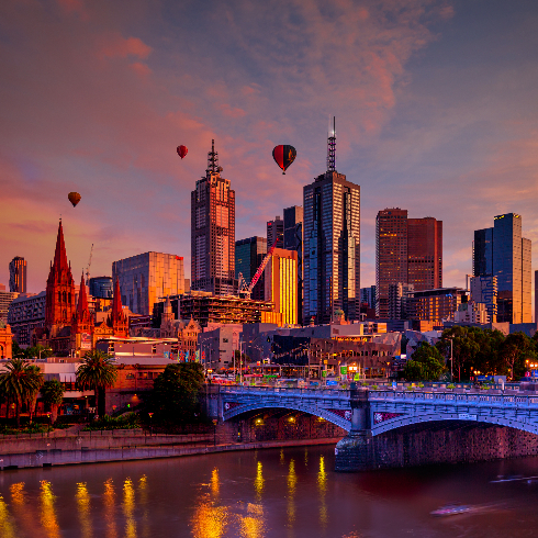 Melbourne, Australia The Melbourne, Australia skyline at sunrise with hot air balloons in flight.