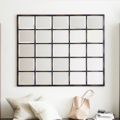 Multi-panel Mirror A multi-panel large mirror made of wood.