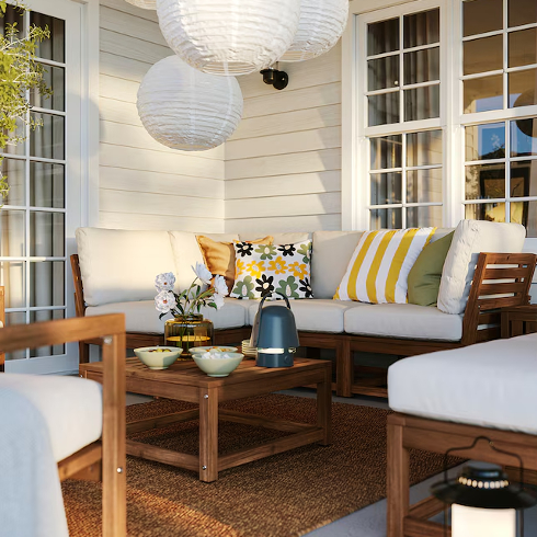 Modular Seating The Naemmaroe modular outdoor soft with cushions in a cozy outdoor patio