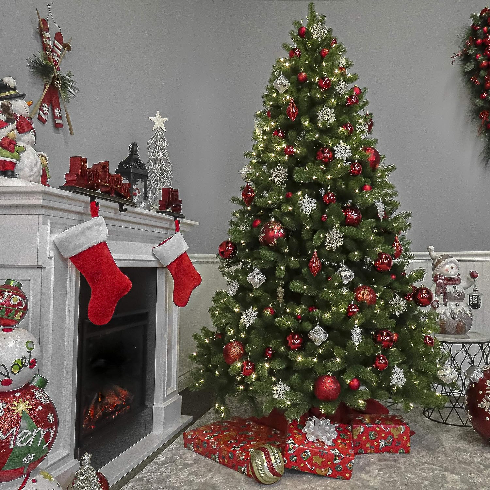 Perfectly Classic A classic Douglas fir artificial Christmas tree decorated with white and red decorations