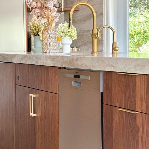Brass Has Sass Walnut kitchen with brass hardware and faucet