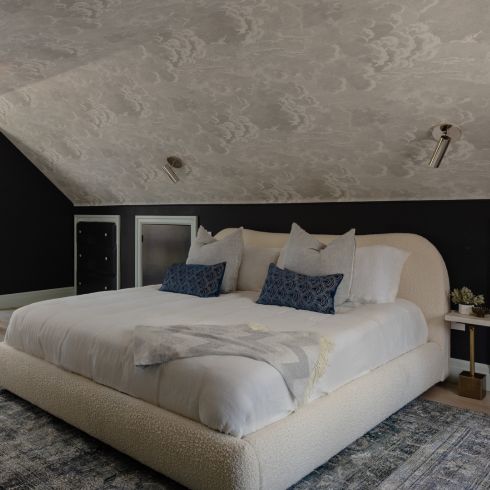 In the Clouds Attic bedroom with wallpaper on the ceiling