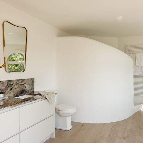 All About the Curve Bedroom with curved shower wall