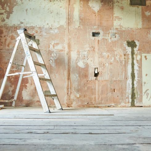 Lead Paint Home renovation with ladder and walls stripped of paint