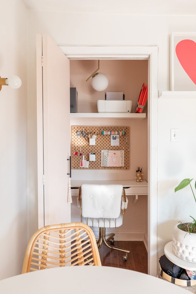 Office Space A tiny narrow closet painted pink and transformed into a small office space with a desk and corkboard organizer