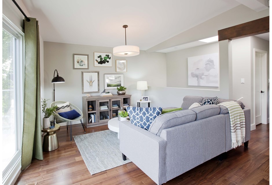 Orientation Express couch in grey open-concept living room
