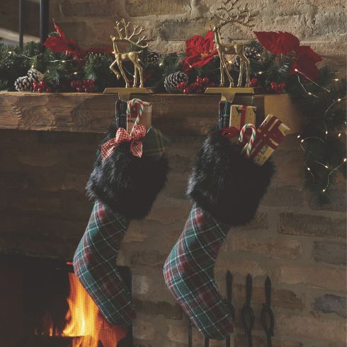 Darling Danglers Plaid Christmas stockings hanging on a mantle