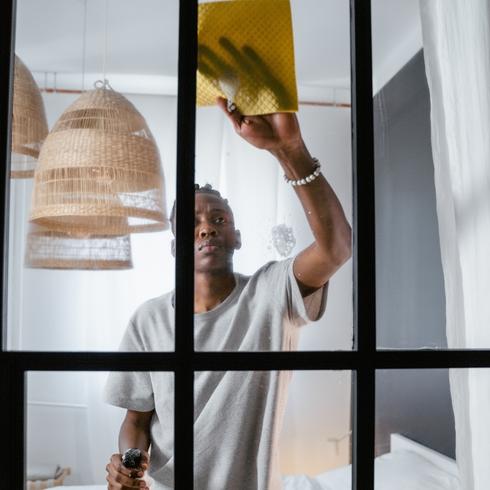 15 Minute Cleaning Routines Man cleaning mirrors