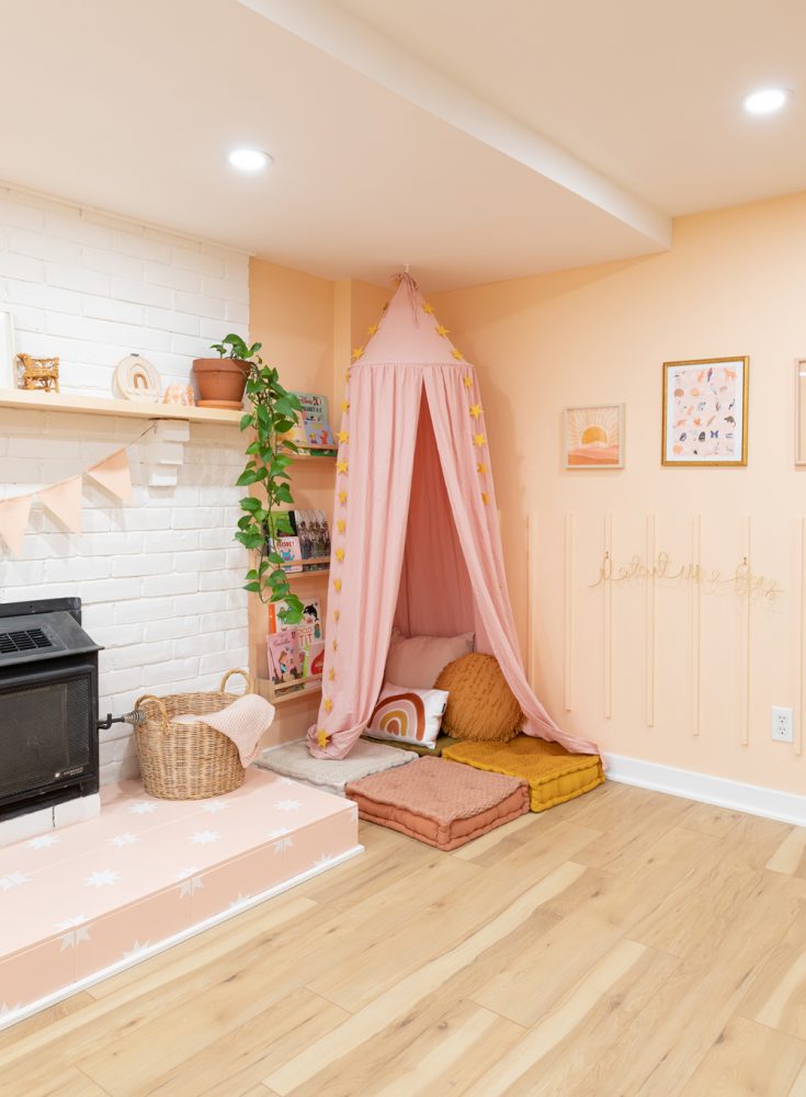 Storytime Style pink reading nook in basement