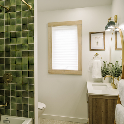 Green With Envy Green shower tiles in bathroom with wood finishes