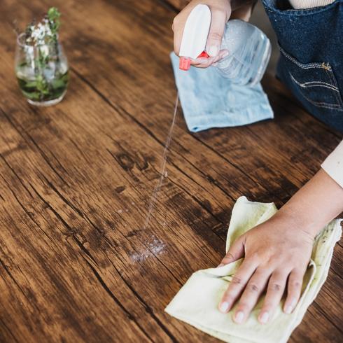 You Act Like a Neat Freak Person wiping countertop