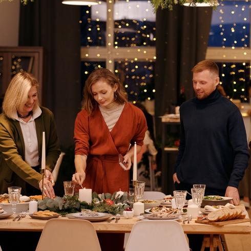 You Expect Guests to Help Themselves to Food Friends setting table for a dinner party