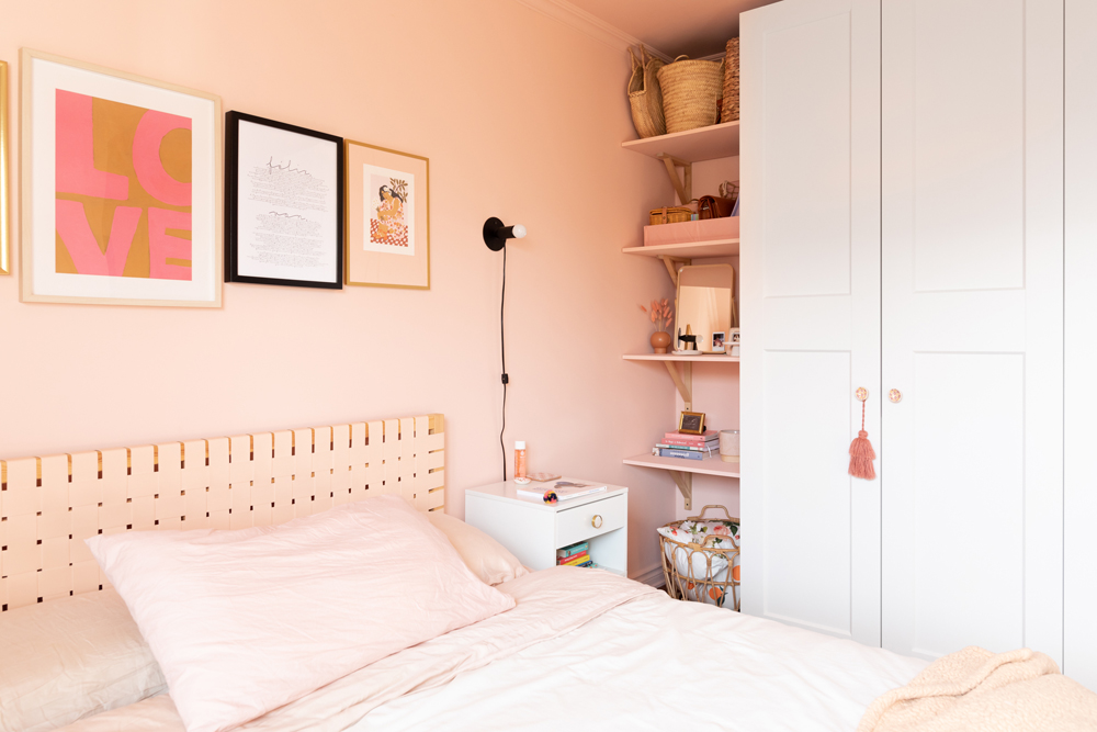 Nurture the Nooks soft pink bedroom with hidden row of shelves beside cabinet