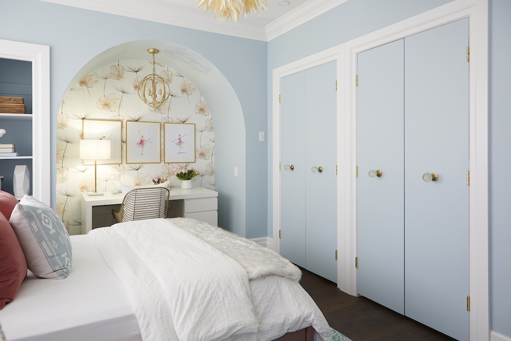Double Duty pale-blue child's bedroom with arched nook for desk