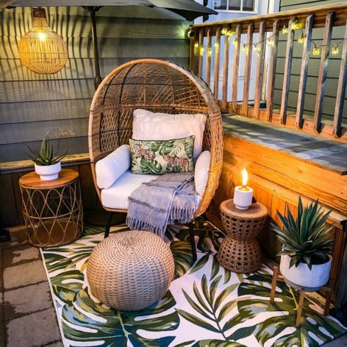 Comfort Zone Small patio with potted plants and outdoor furniture