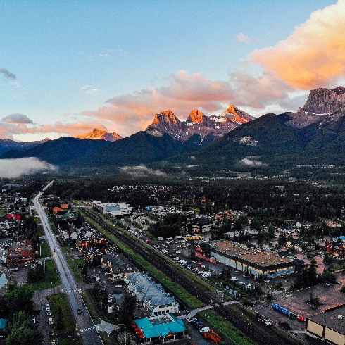 Canmore, Alberta An aerial view of Canmore, Alberta with mountains in the background.