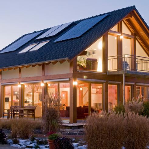 Solar Panels A house exterior with solar panels on an A-frame roof