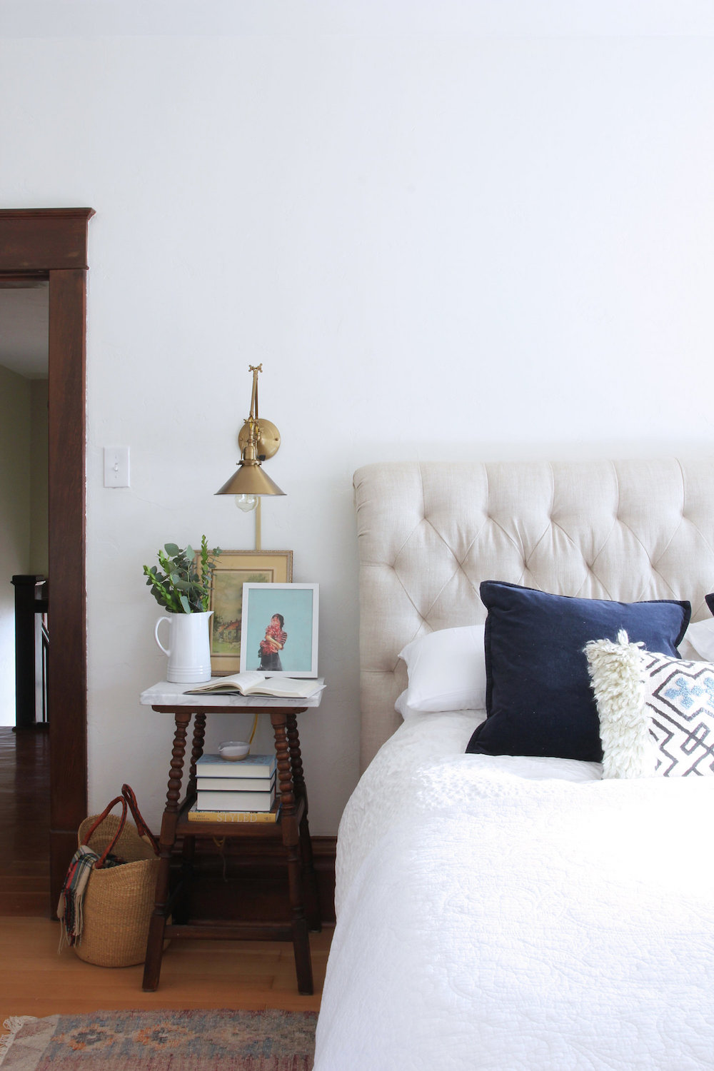 Try a Stool for a Table A country farmhouse bedroom showing a stool as a nightstand