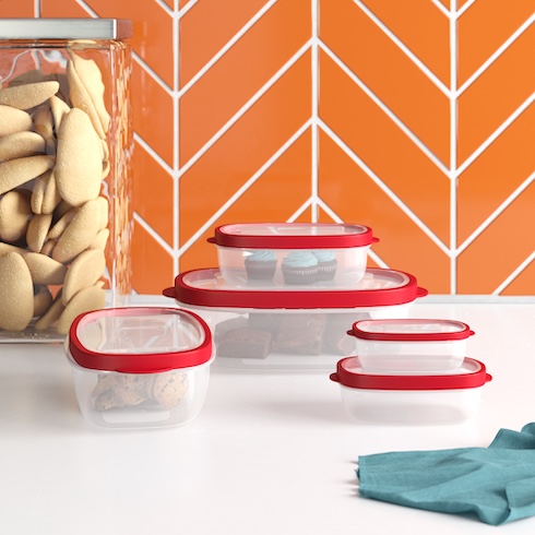 Be Prepared to Share Five storage containers with red lids store leftover on a white counter.