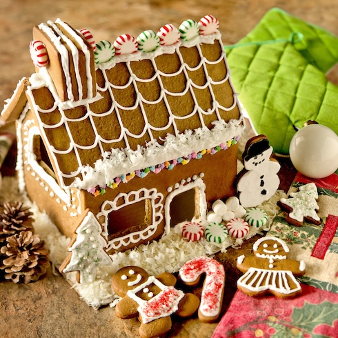 Embrace Entertainment A festive gingerbread house with candy and cookie decorations surrounding it.Often, some of the stress of hosting a holiday event comes from worrying about whether your guests will be bored or feel awkward — especially if you’re bringing together a group of people who may not all know each other well. A stress-reducing solution? Plan some activities, games or entertainment to help break the ice and keep guests entertained. Activities like decorating cookies or gingerbread houses can be fun for kid-friendly events, while holiday-themed trivia may help adult guests get in the festive spirit. Gingerbread House Bake Set, Wayfair.ca, $29.