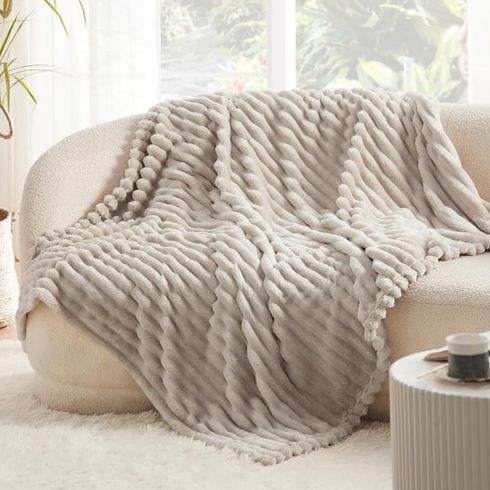 Fluffy Fleece Throw Blanket Grey fluffly fleece throw blanket on white sofa